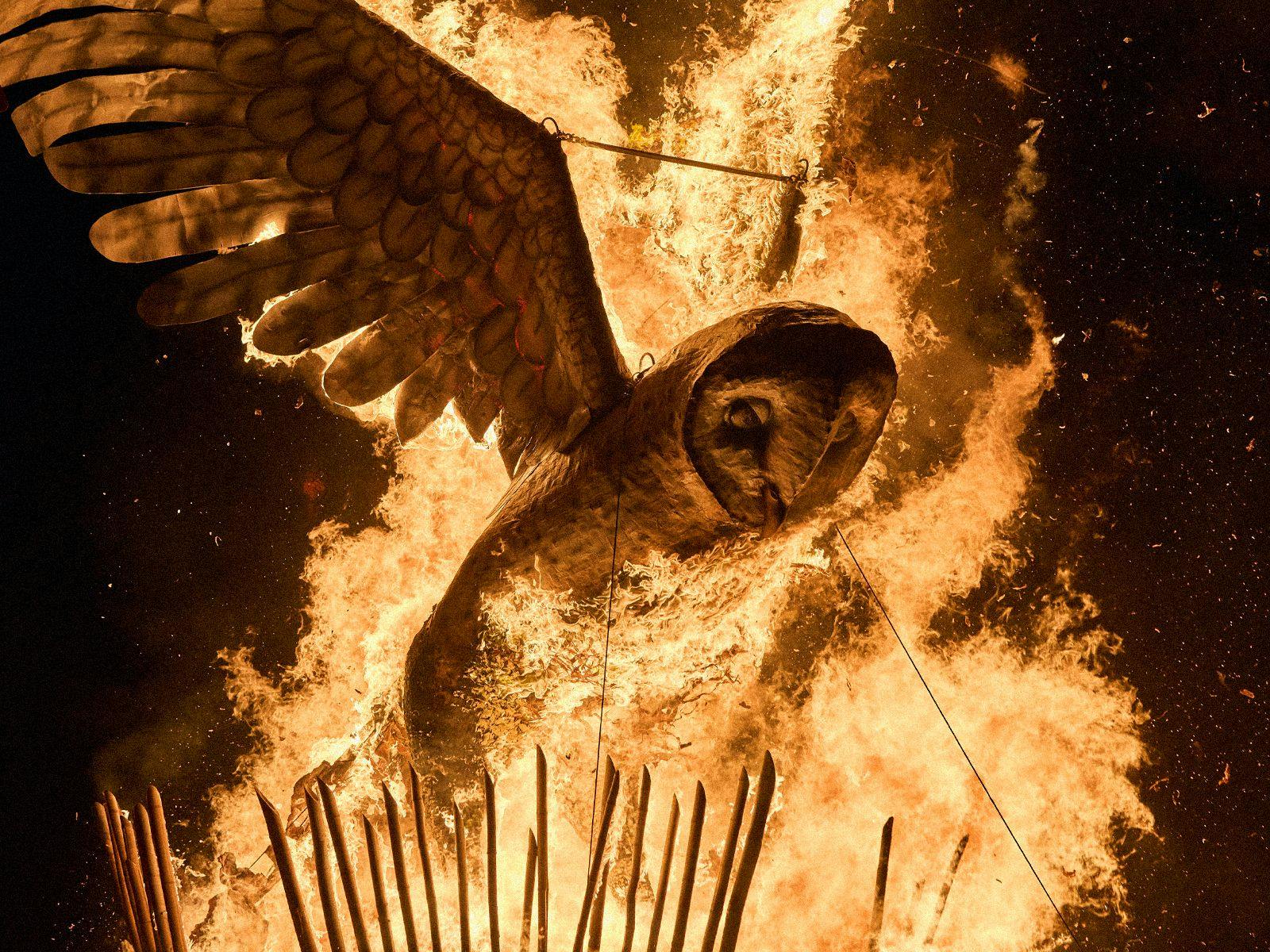 The giant Ogoh Ogoh owl bursting with flames.