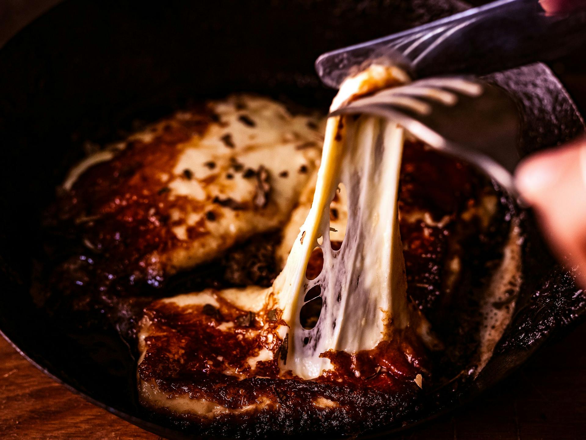 Stretchy haloumi cheese in a frying pan